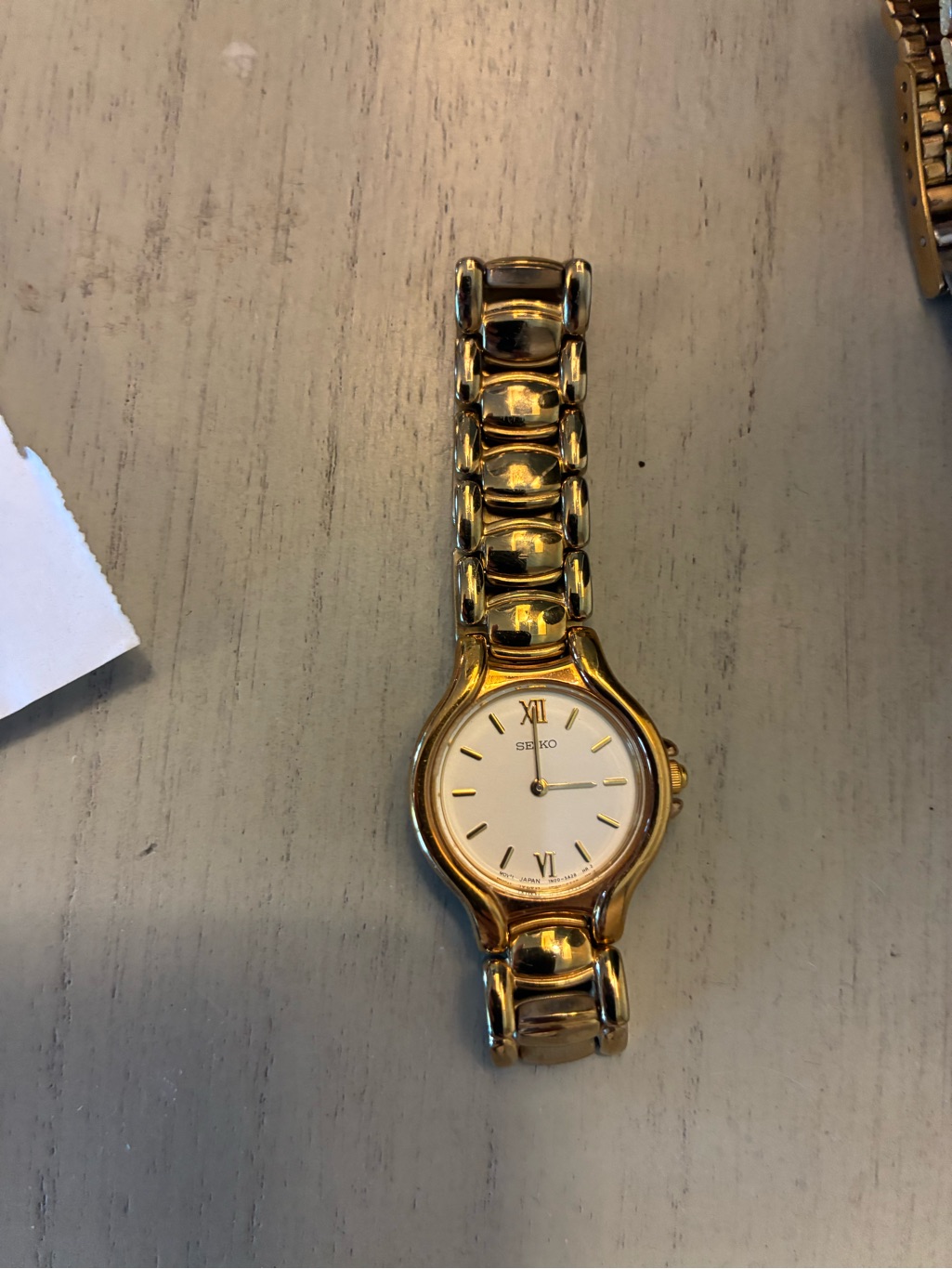 Seiko Gold Tone Watch With White Dial And Roman Markers